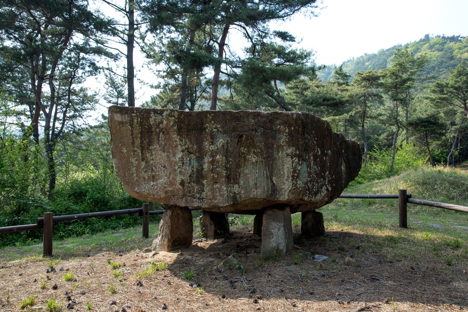 A large capstone dolmen balanced on supporting stones at the Gochang dolmen site