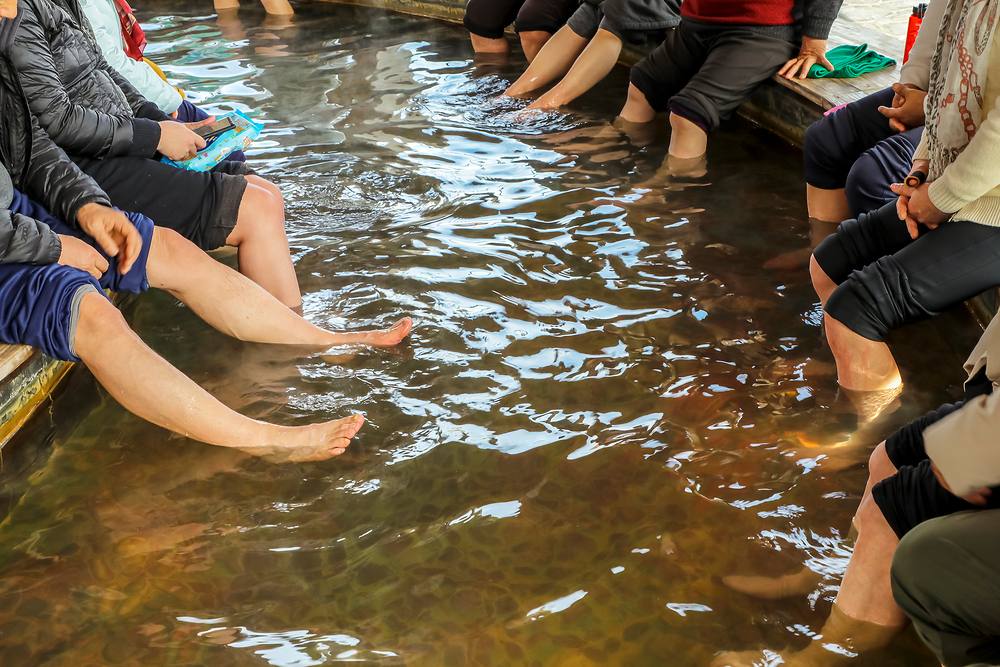 Locals taking a foot bath at an outdoor public hot spring in Yuseong, Daejeon