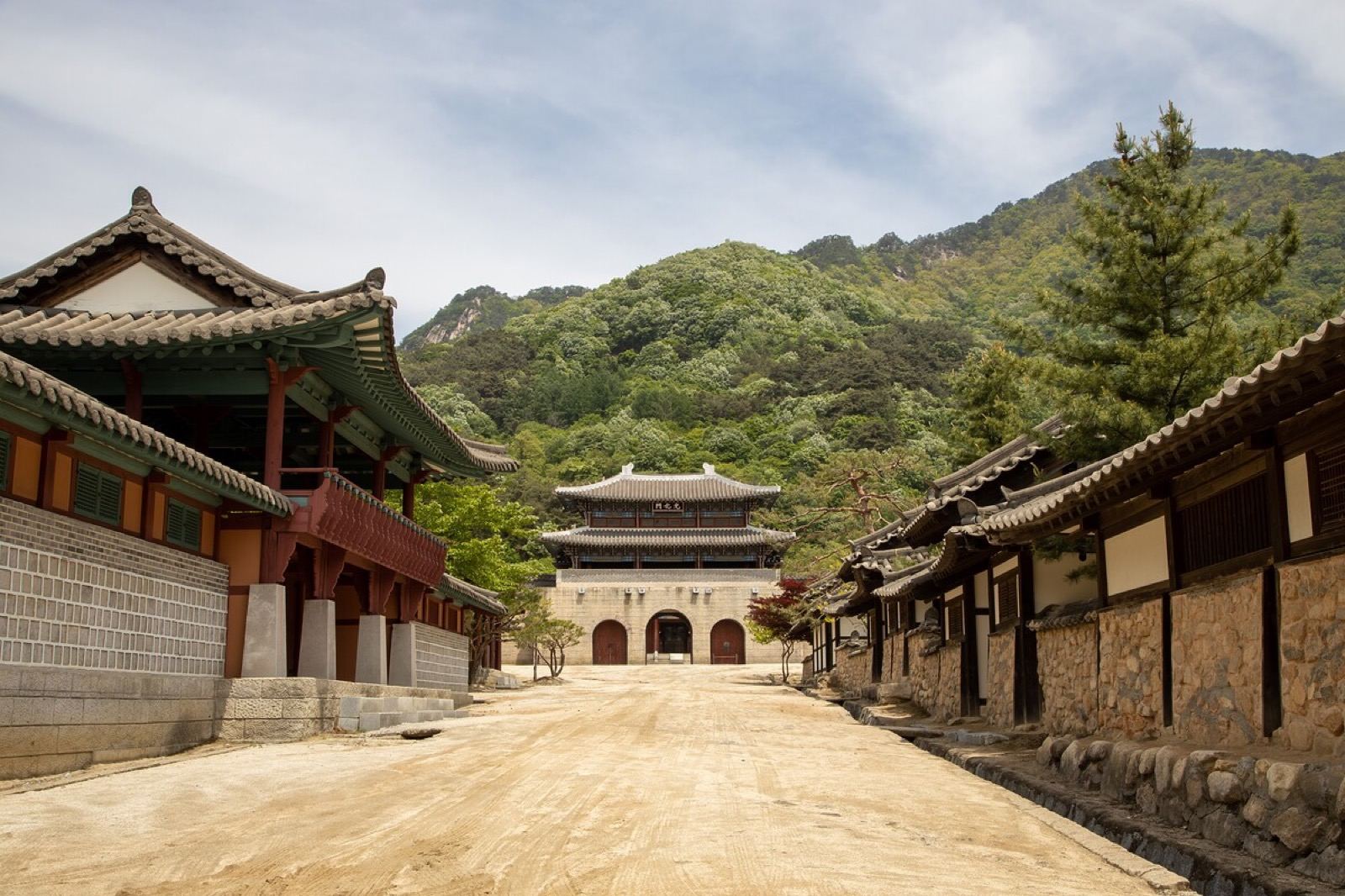 A reconstructed Joseon-era palace gate and tiled buildings at the Mungyeong Saejae film set